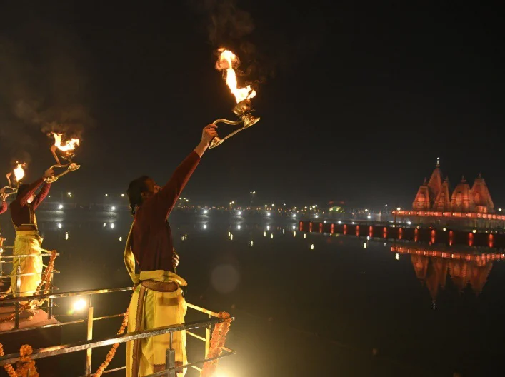 Evening aarti beside the illuminated waters of Brahma Sarovar